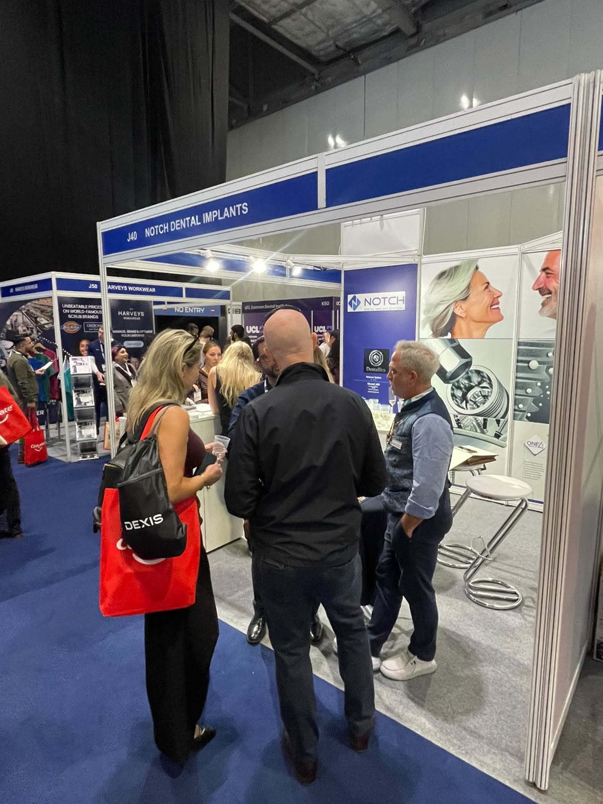 Visitors talking with the NOTCH team at Stand J40